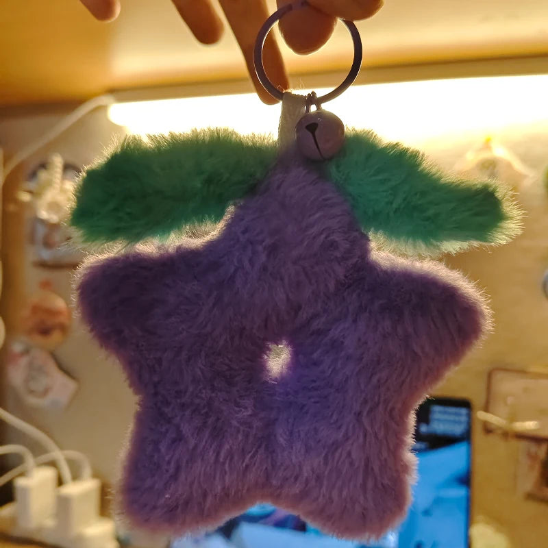 Close-up view of the Stardrop Plush Keychain, showing the super soft material and vibrant purple color