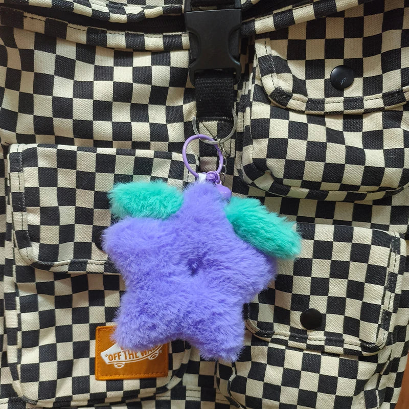 Stardrop Plush Keychain attached to a backpack strap for size reference, highlighting its portability