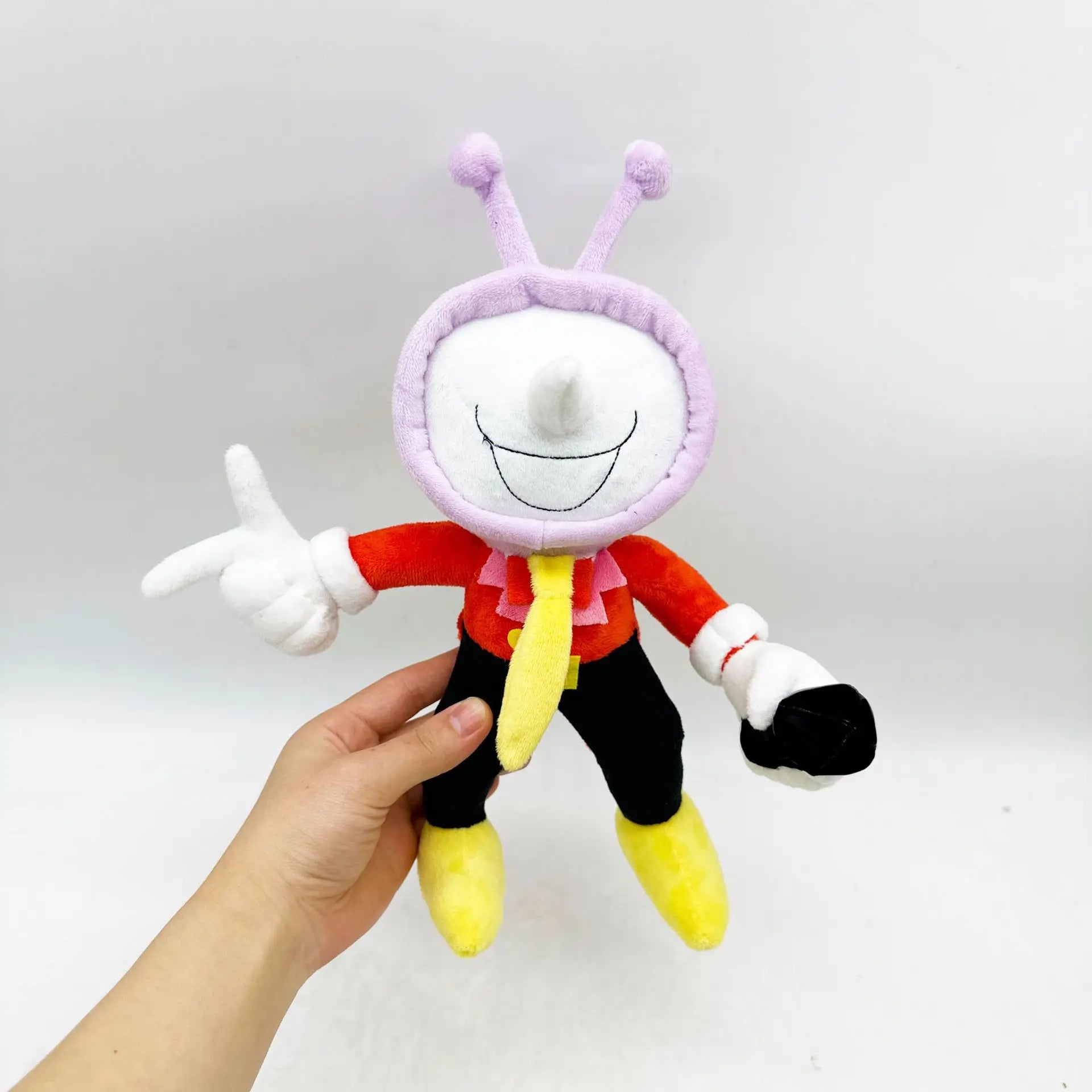 The Tenna plush toy held in a hand for size comparison, an ideal DELTARUNE plush collectible