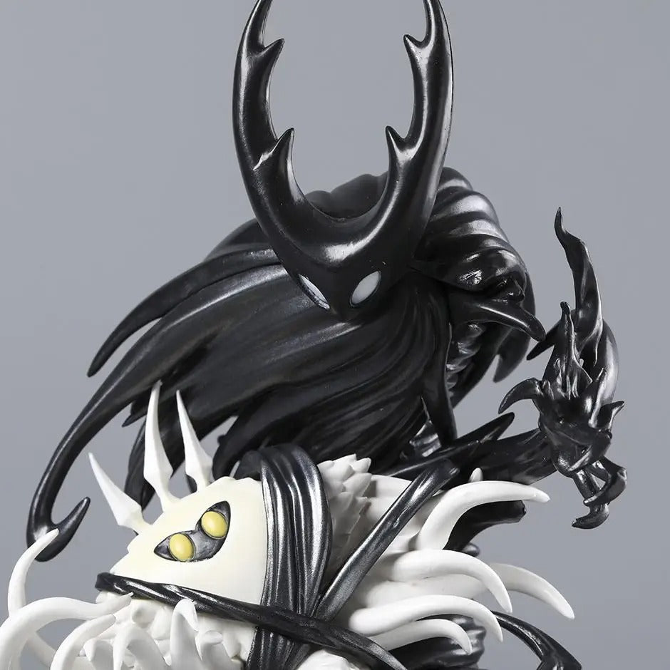 Close-up detail of the orange infection and cracked horn sculpt on The Hollow Knight & The Radiance Figure model.