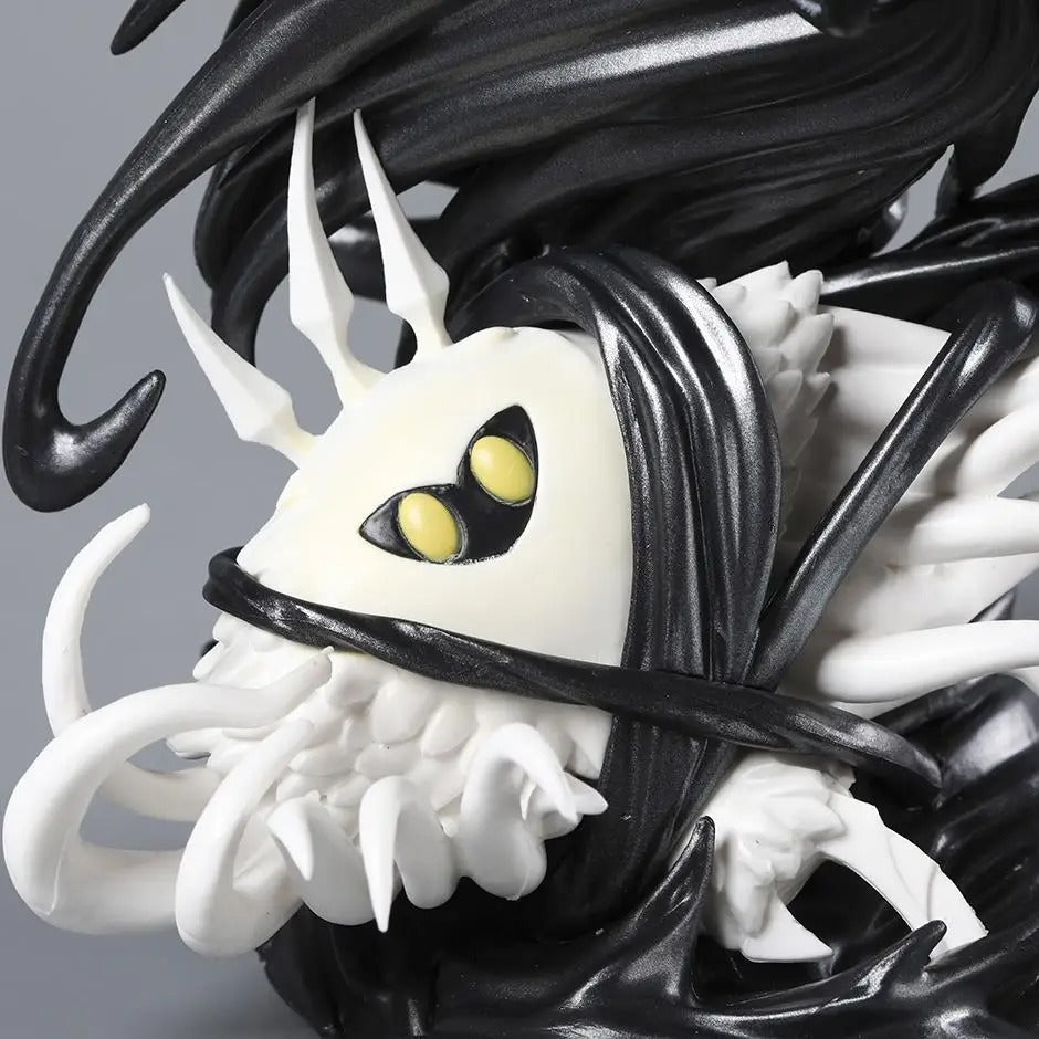 Close-up detail of the orange infection and cracked horn sculpt on The Hollow Knight & The Radiance Figure model.