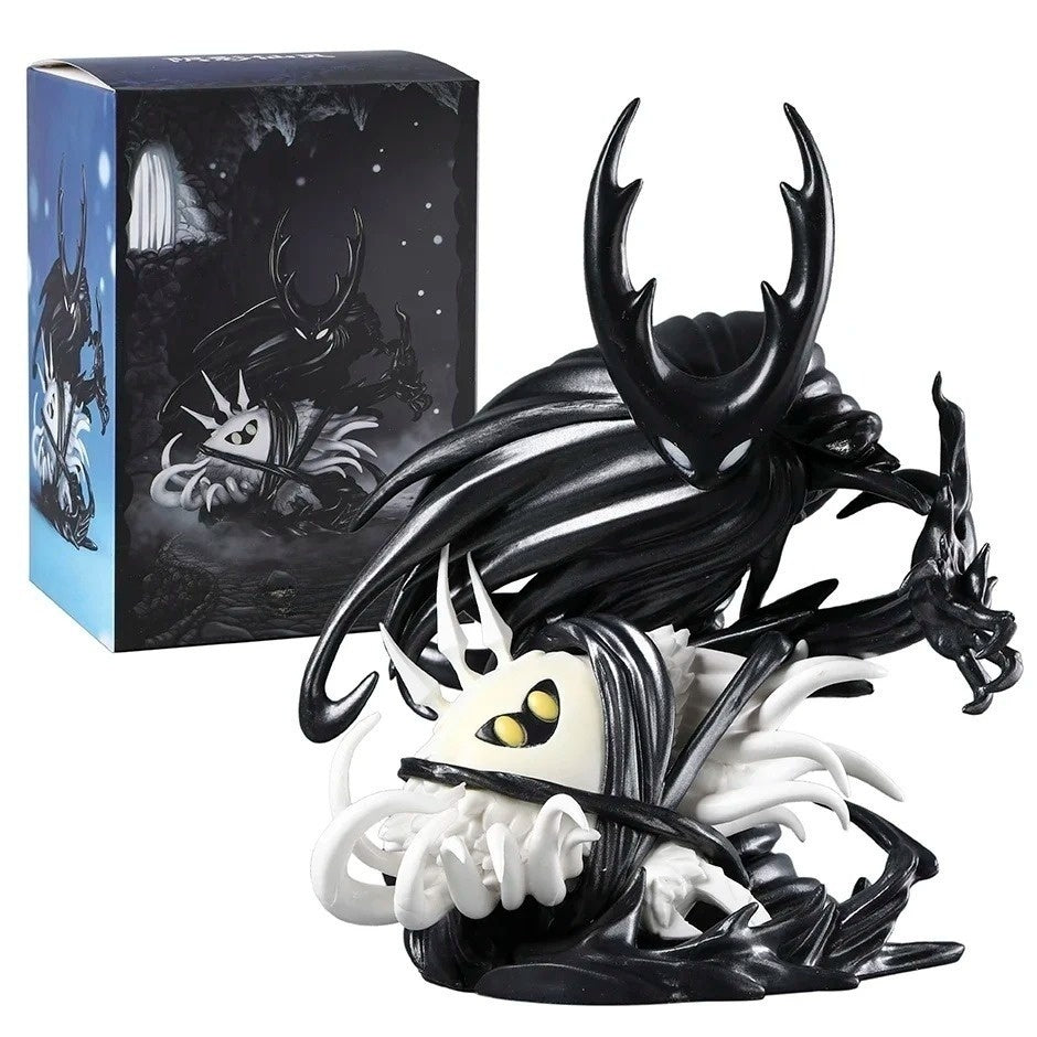 Front view of The Hollow Knight & The Radiance Figure showing the infected Vessel and blazing Radiance, posed in front of its original illustrated packaging box on a solid white background.