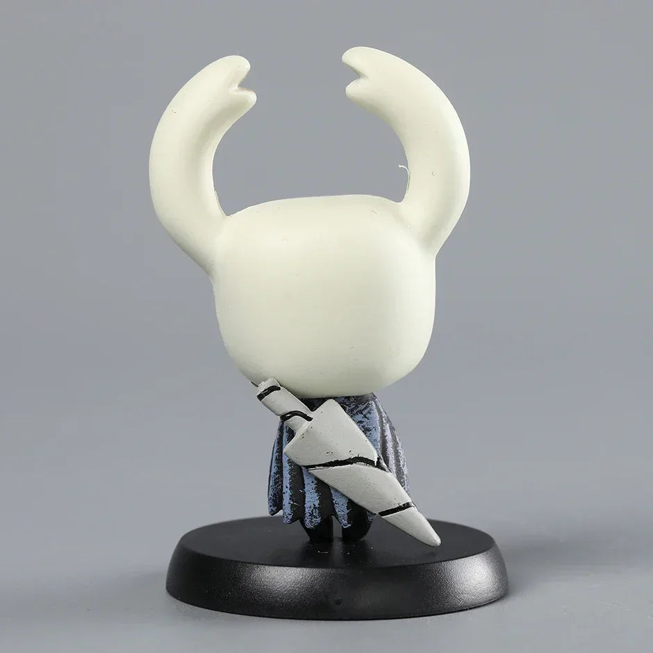 Back view of the The Knight Mini Figure in a heroic stance, essential Hollow Knight Merch